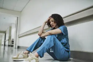 Overworked nurse experiencing burnout – Staff Relief Inc. addresses nurse staffing challenges